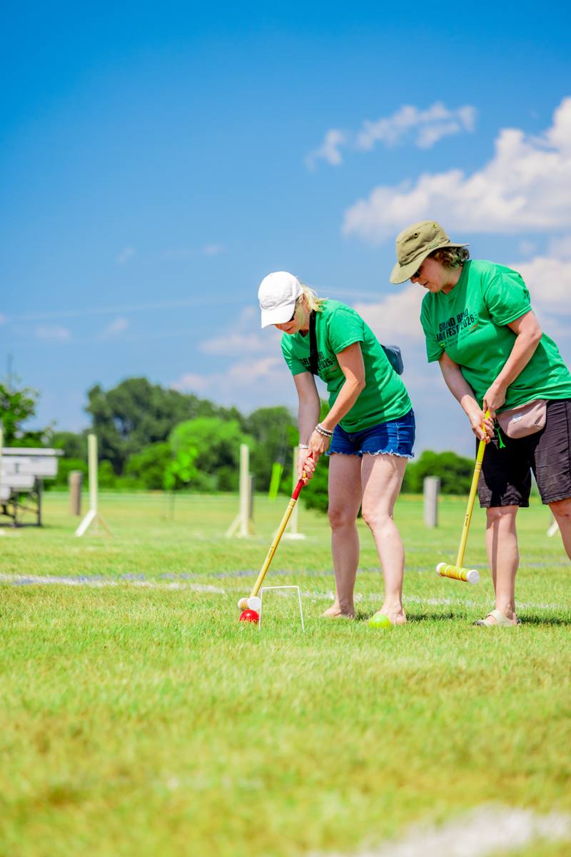 Guests playing croquet on the field at Jam Fest