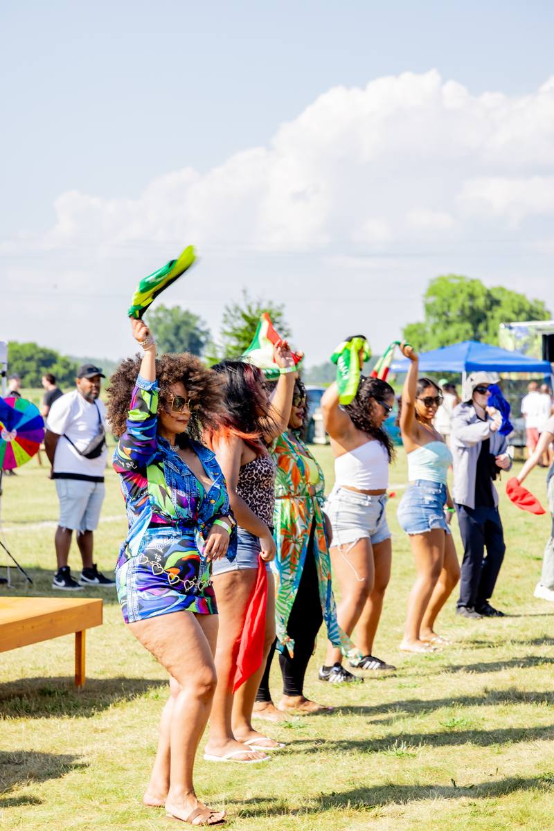 Dancers with Jamaican flags at Grand Bend Jam Fest